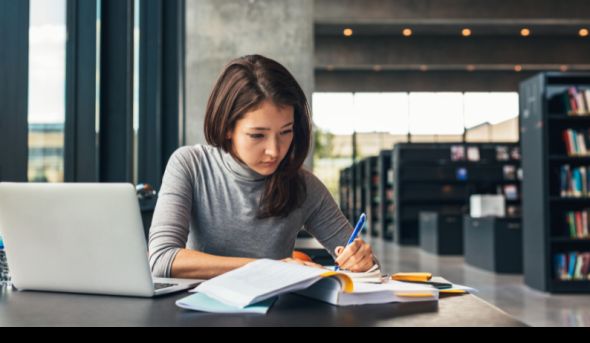 student studying in library