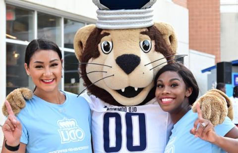 Two students with Big Blue ODU mascot